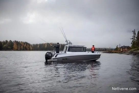 Fishing boat on calm waters with two anglers; one casts a line, surrounded by autumn trees and a distant cabin.